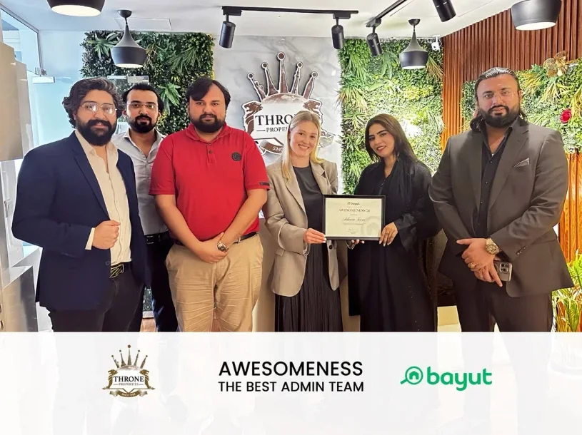 Throne Properties team receiving the Bayut Awesomeness award for the best admin team